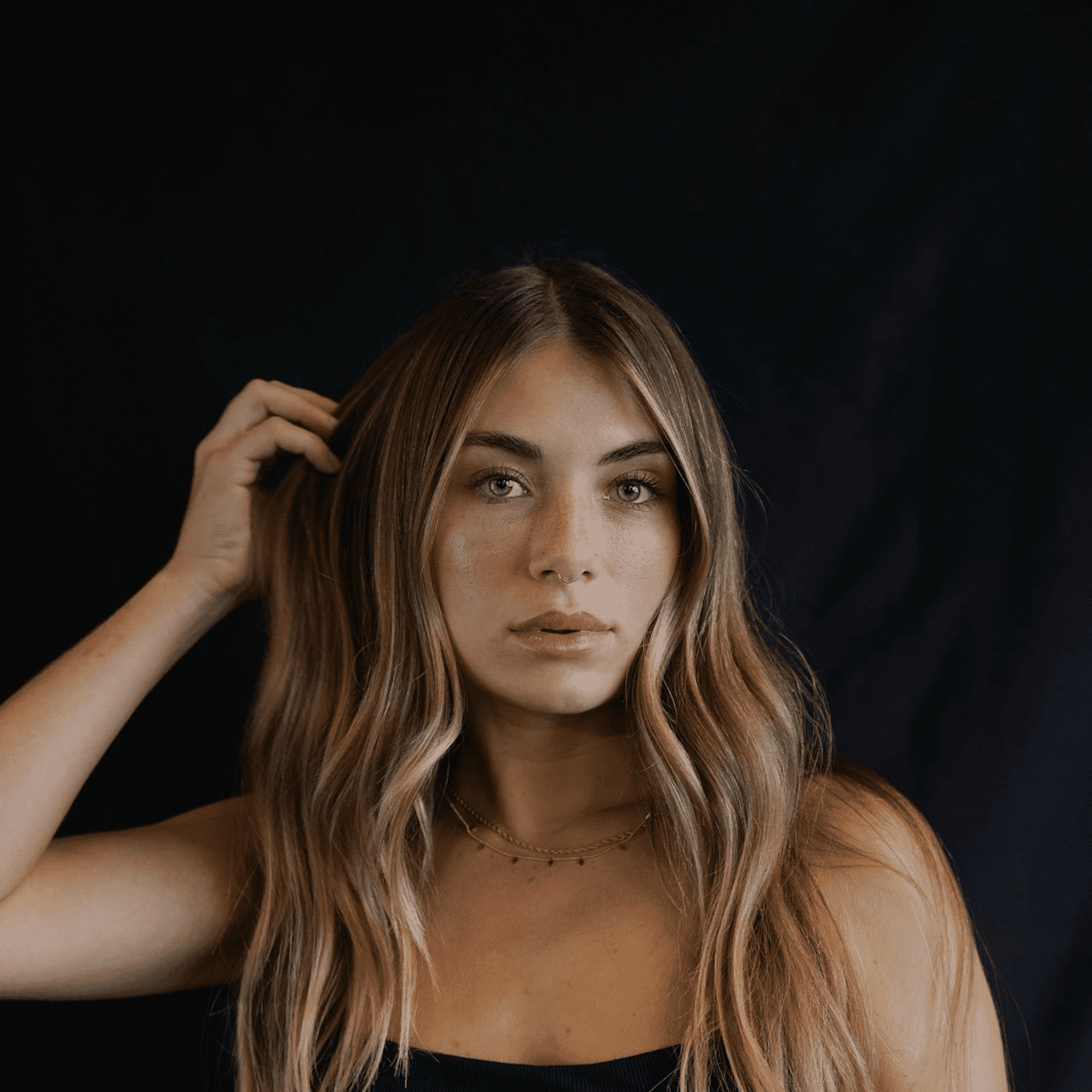 Portrait of Jessie, a professional stylist at MixxHouse Salon, showcasing their expertise and style.